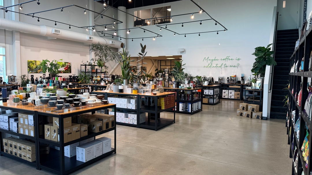 Bright and open Calgary showroom with coffee, accessories, cups, grinders, espresso machines, and parts.