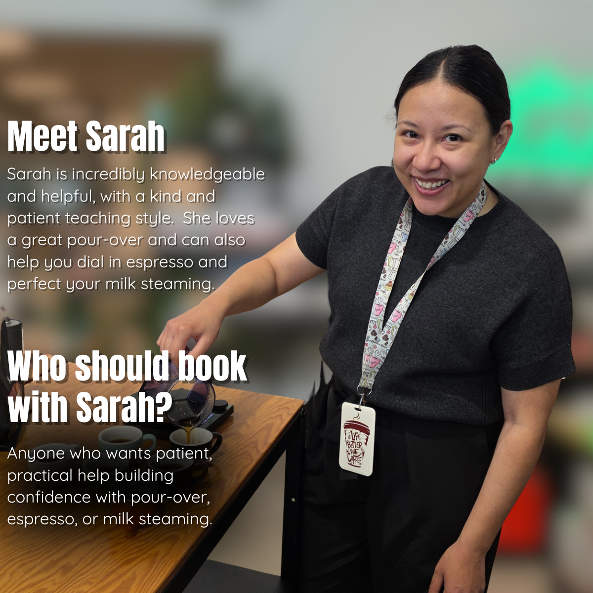 A smiling woman in a dark gray t-shirt and black pants stands behind a wooden counter, wearing a patterned lanyard with a badge. White text overlays on the left describe her qualities as a tea and coffee specialist.