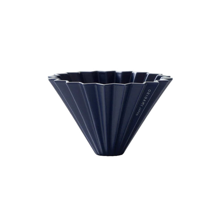 Navy blue ceramic coffee dripper on a white background