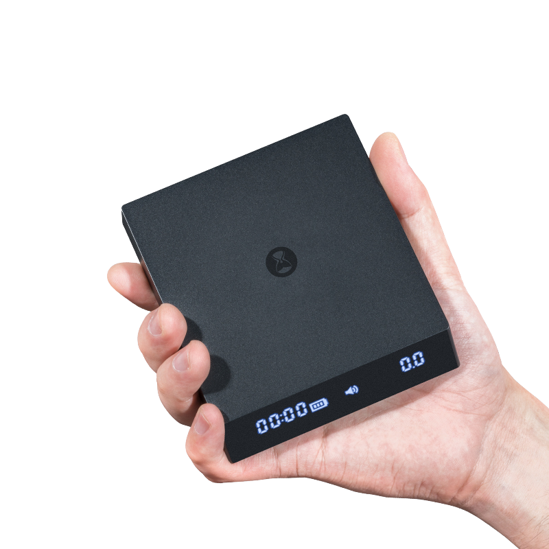 Timemore Black Mirror Nano Espresso Scale in hand for size comparison